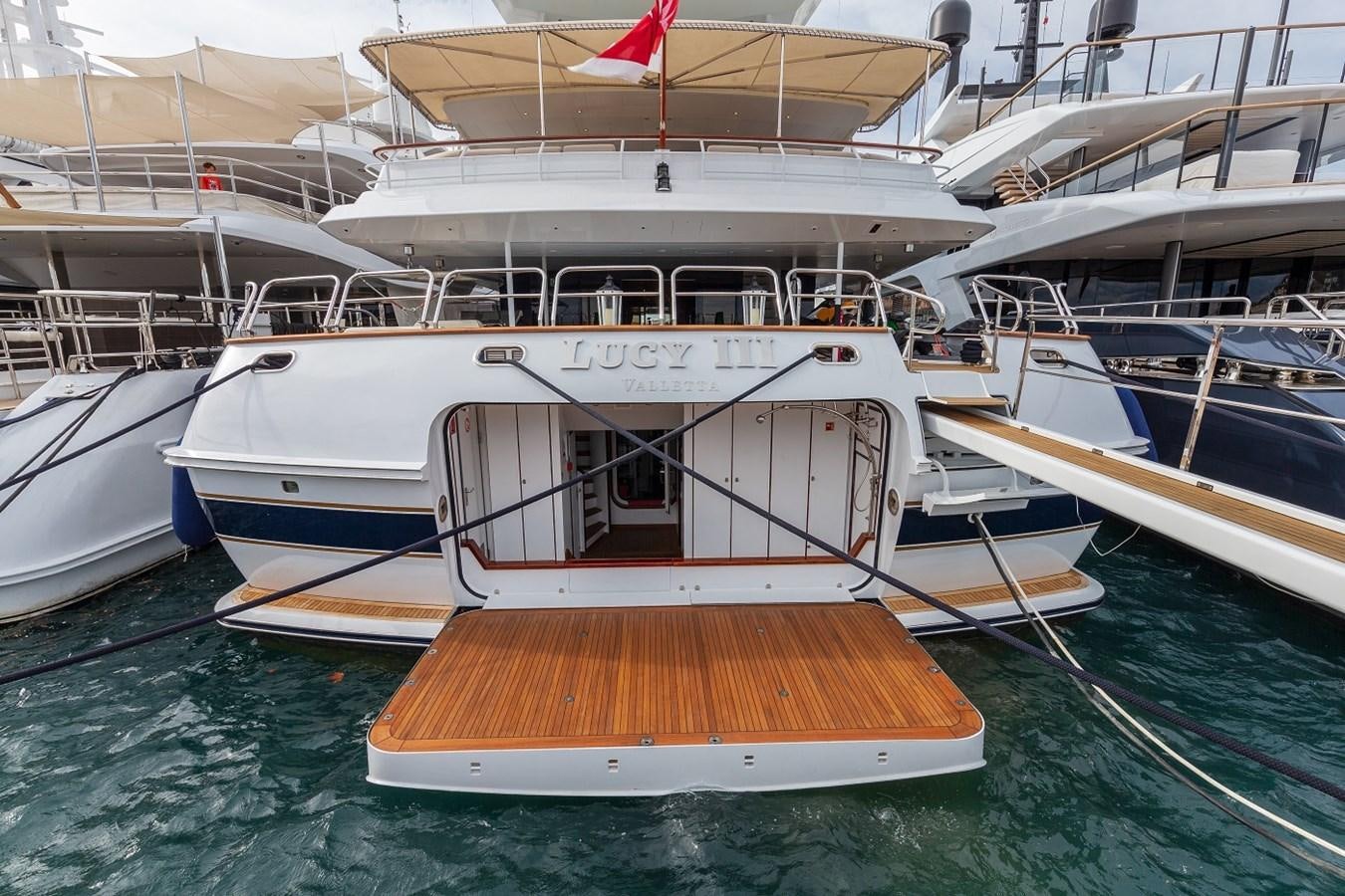 a boat docked at a pier aboard LUCY III Yacht for Sale