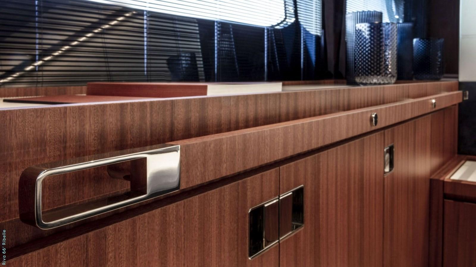 a wooden cabinet with a shelf aboard N1 Yacht for Sale