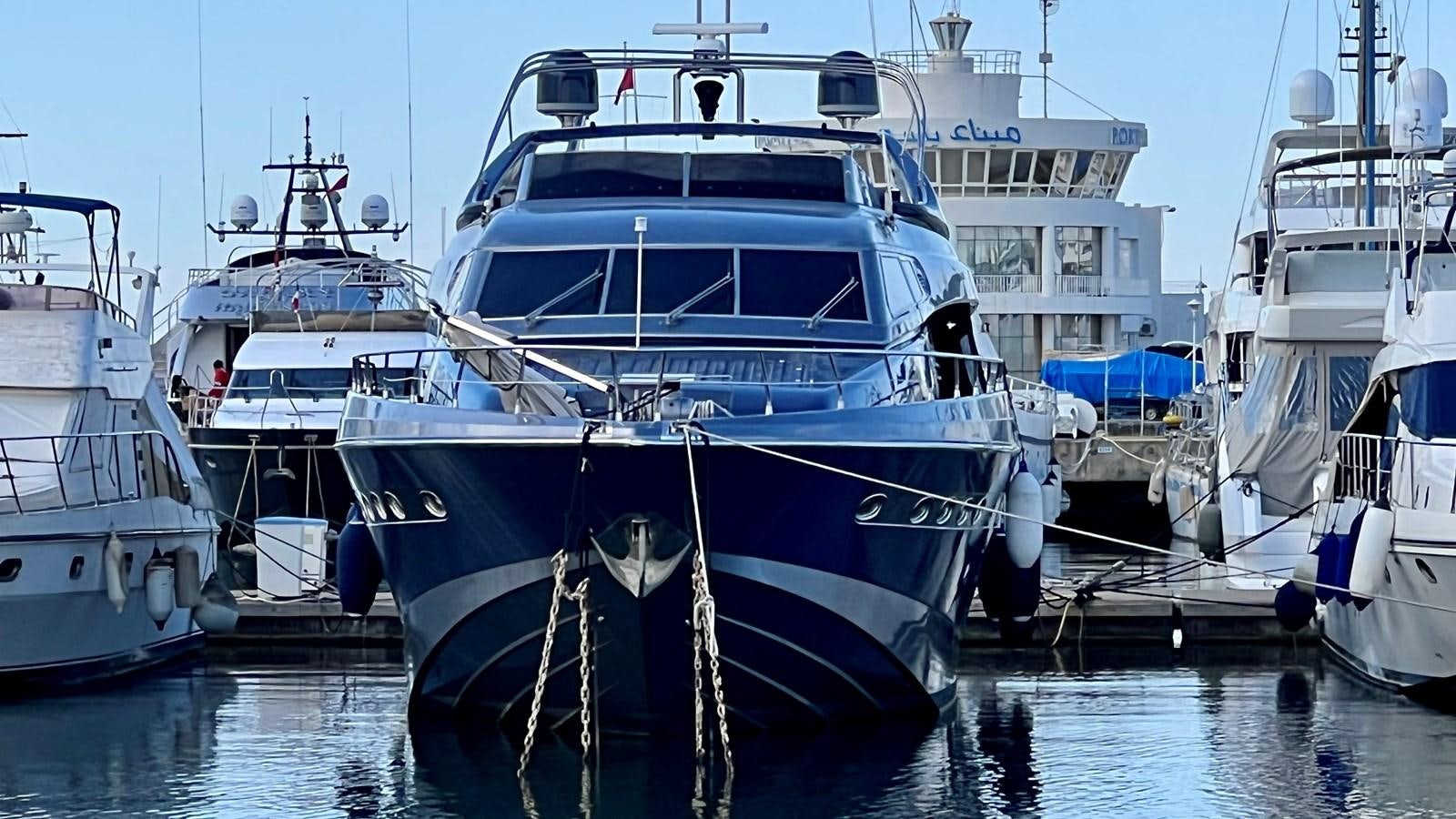 a group of boats are parked in a harbor aboard AZUR LE ROI Yacht for Sale