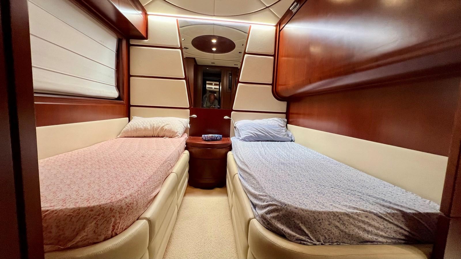a room with two beds aboard AZUR LE ROI Yacht for Sale