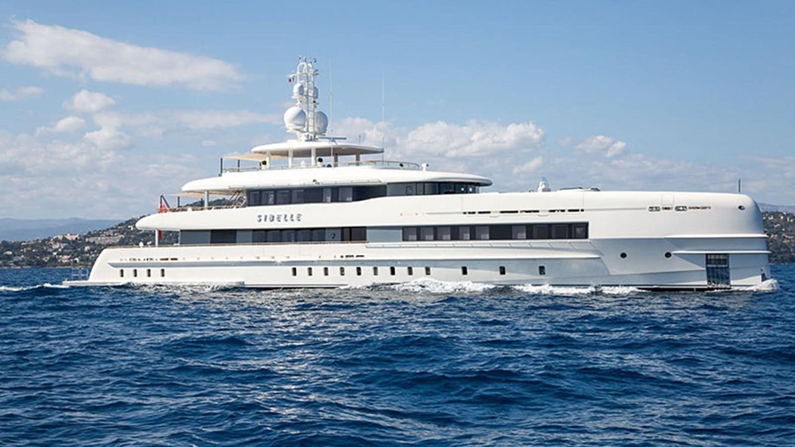 a large white ship in the water aboard SIBELLE Yacht for Sale