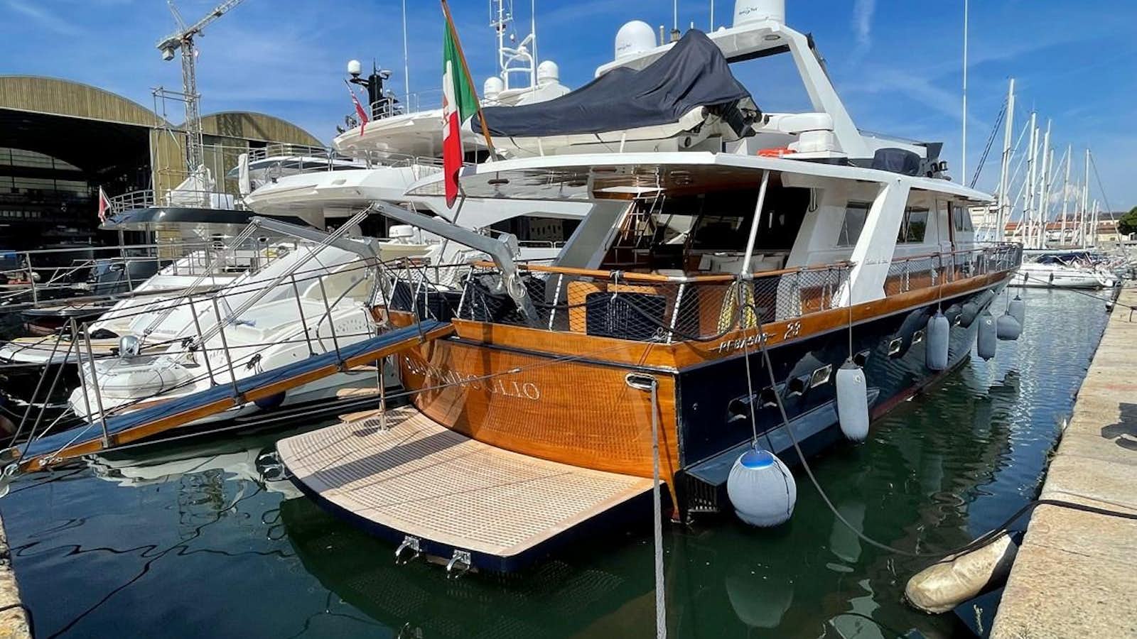 a boat docked at a pier aboard QUADRIFOGLIO Yacht for Sale