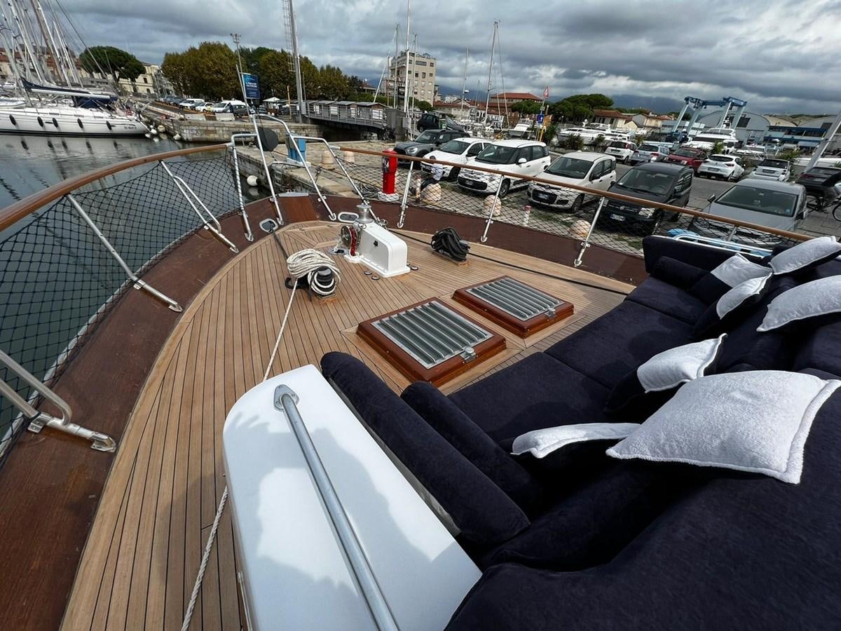 a deck with a deck and a view of a city aboard QUADRIFOGLIO Yacht for Sale