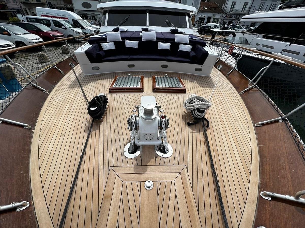 a deck with a boat and a deck with a deck and a boat aboard QUADRIFOGLIO Yacht for Sale