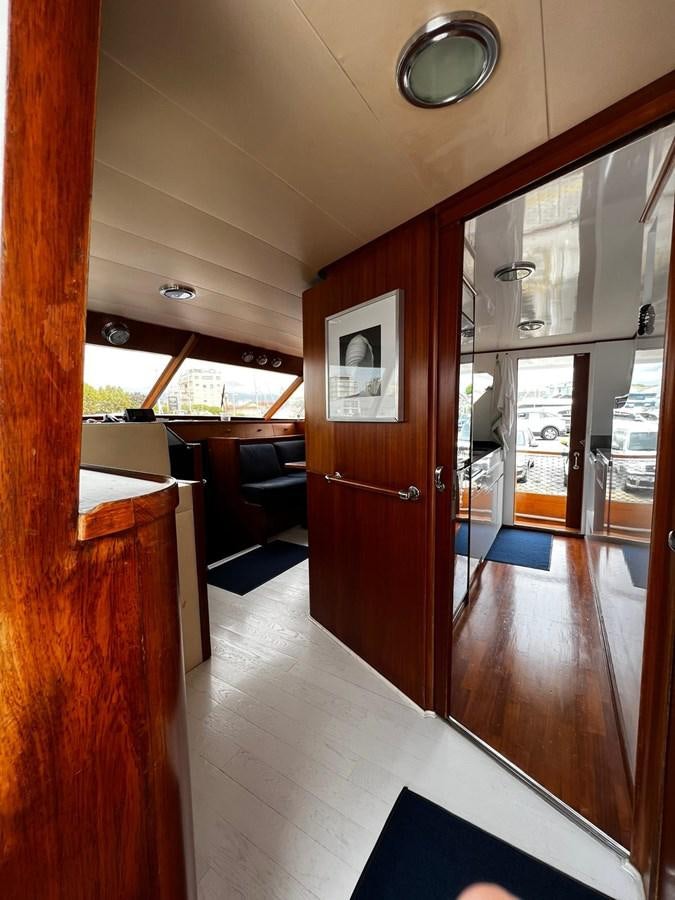 a room with a wood door and a wood door aboard QUADRIFOGLIO Yacht for Sale
