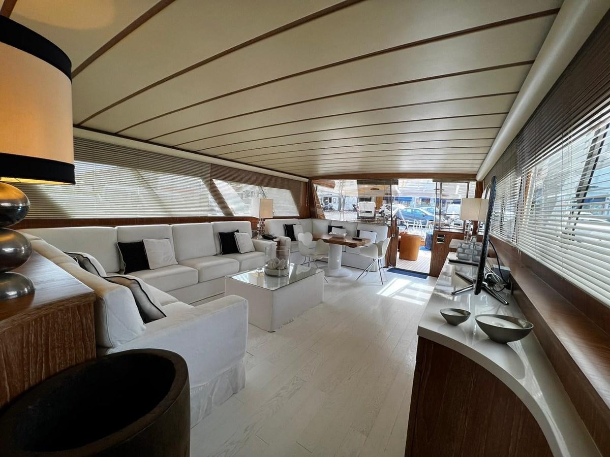 a room with a large window aboard QUADRIFOGLIO Yacht for Sale
