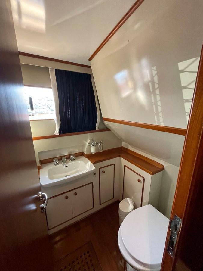 a bathroom with a sink and toilet aboard QUADRIFOGLIO Yacht for Sale