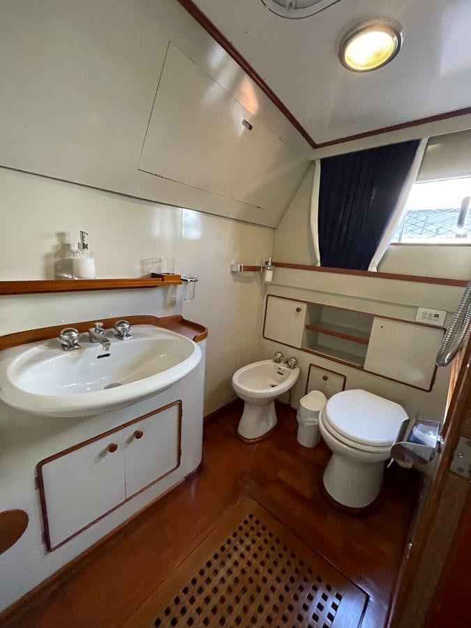 a bathroom with a sink and toilet aboard QUADRIFOGLIO Yacht for Sale