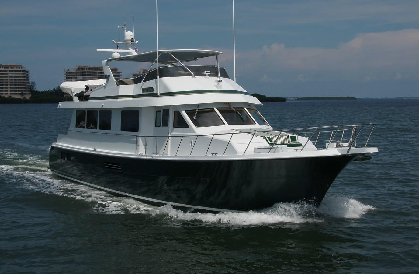 a white boat on the water aboard BOOGIE BABE III Yacht for Sale