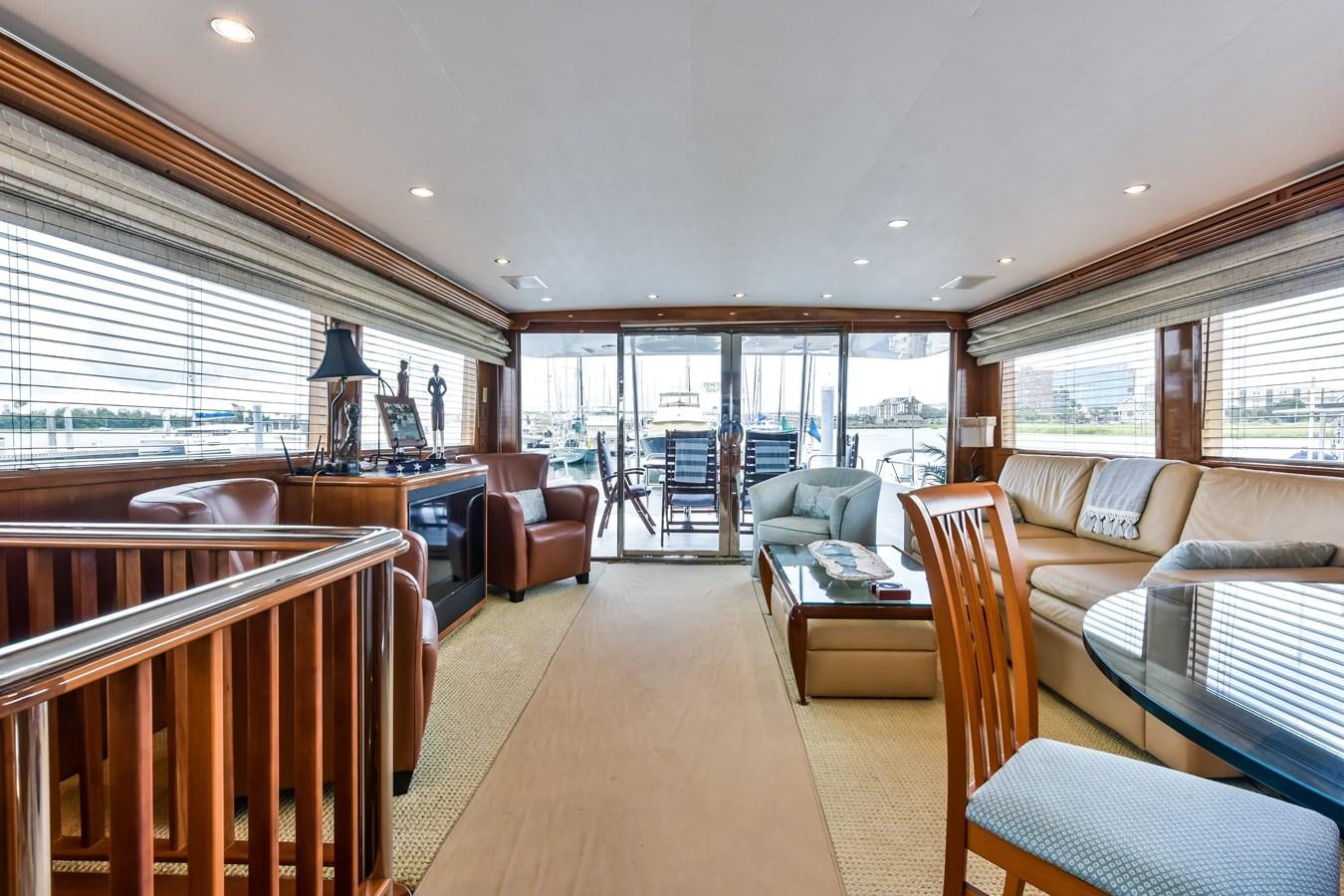 a living room with a large window aboard BOOGIE BABE III Yacht for Sale