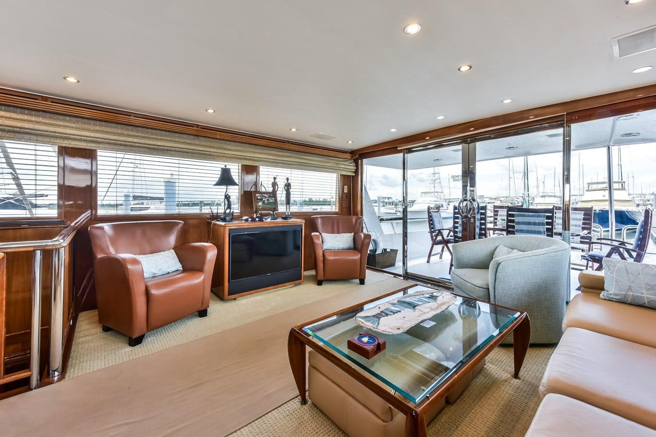 a living room with a fireplace aboard BOOGIE BABE III Yacht for Sale