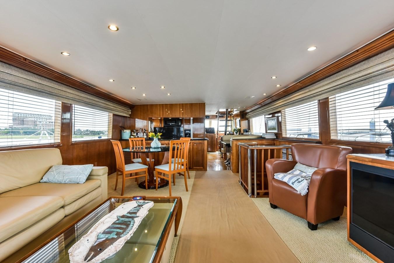 a living room with a couch and a table aboard BOOGIE BABE III Yacht for Sale