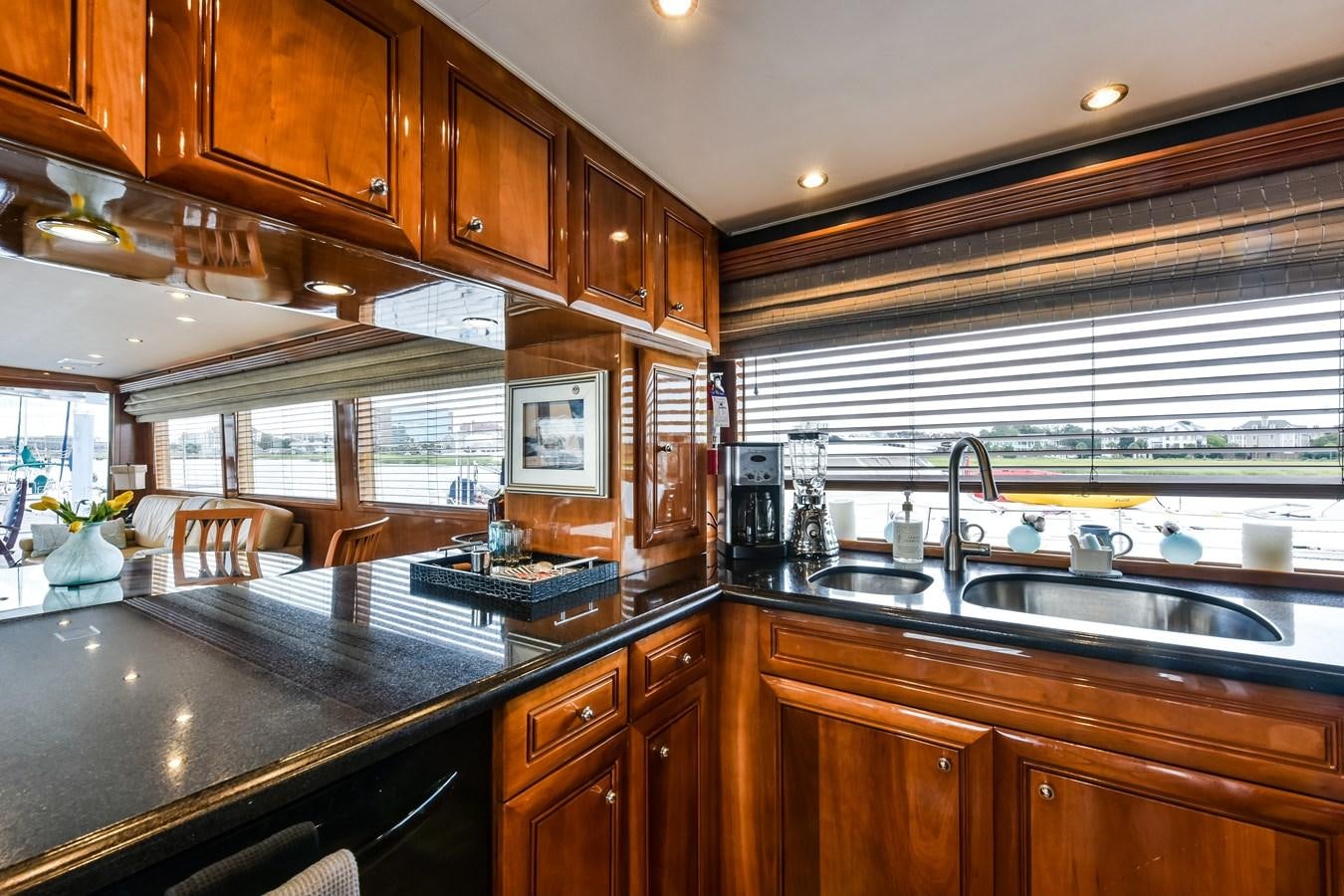 a kitchen with wooden cabinets aboard BOOGIE BABE III Yacht for Sale