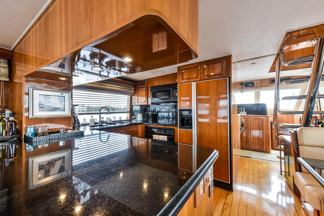 a large kitchen with a fireplace aboard BOOGIE BABE III Yacht for Sale