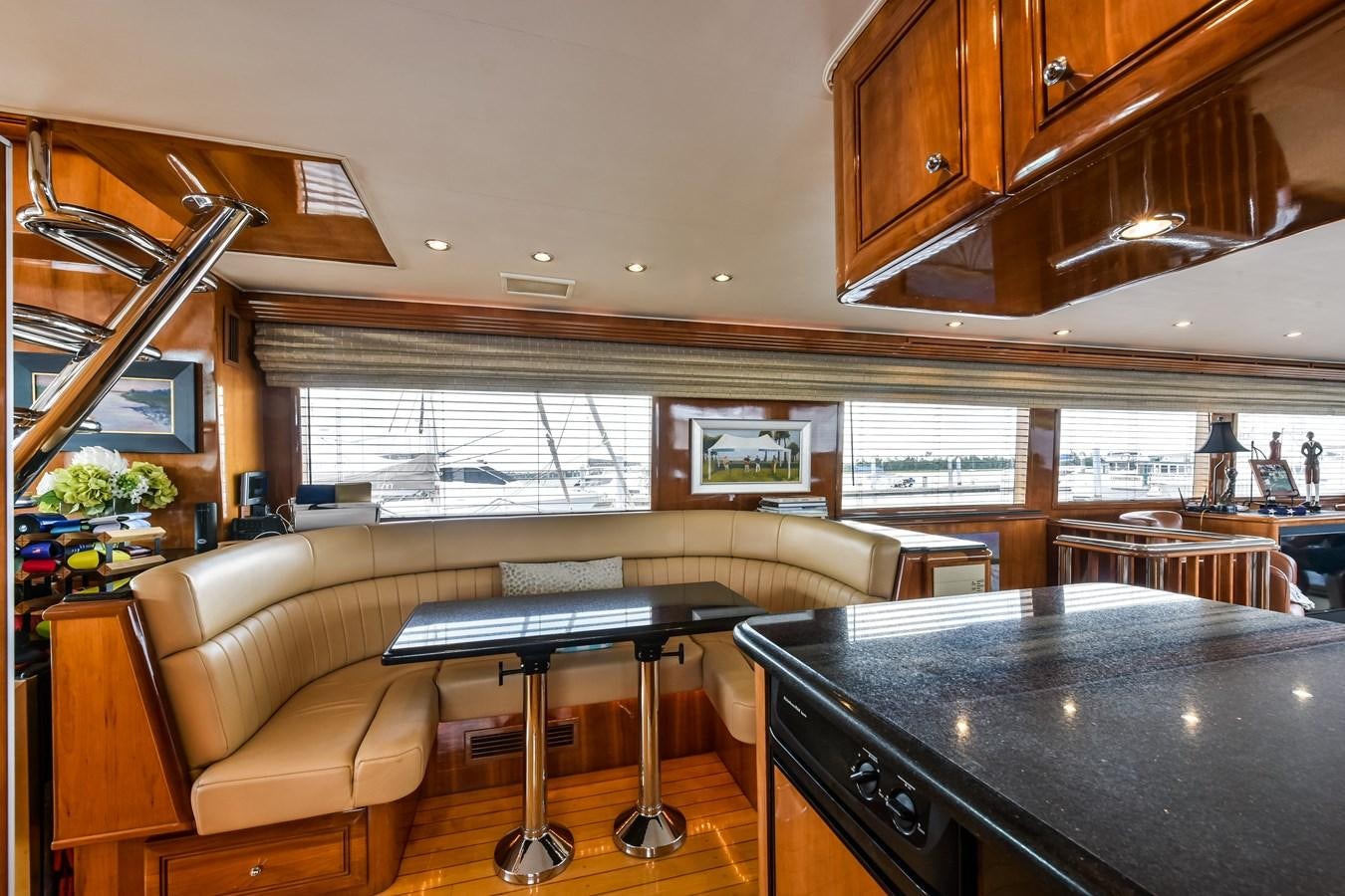 a room with a table and chairs aboard BOOGIE BABE III Yacht for Sale