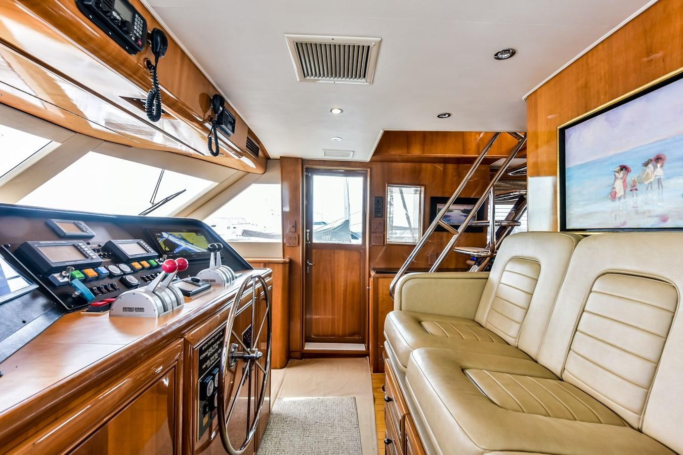 a room with a couch and a table aboard BOOGIE BABE III Yacht for Sale
