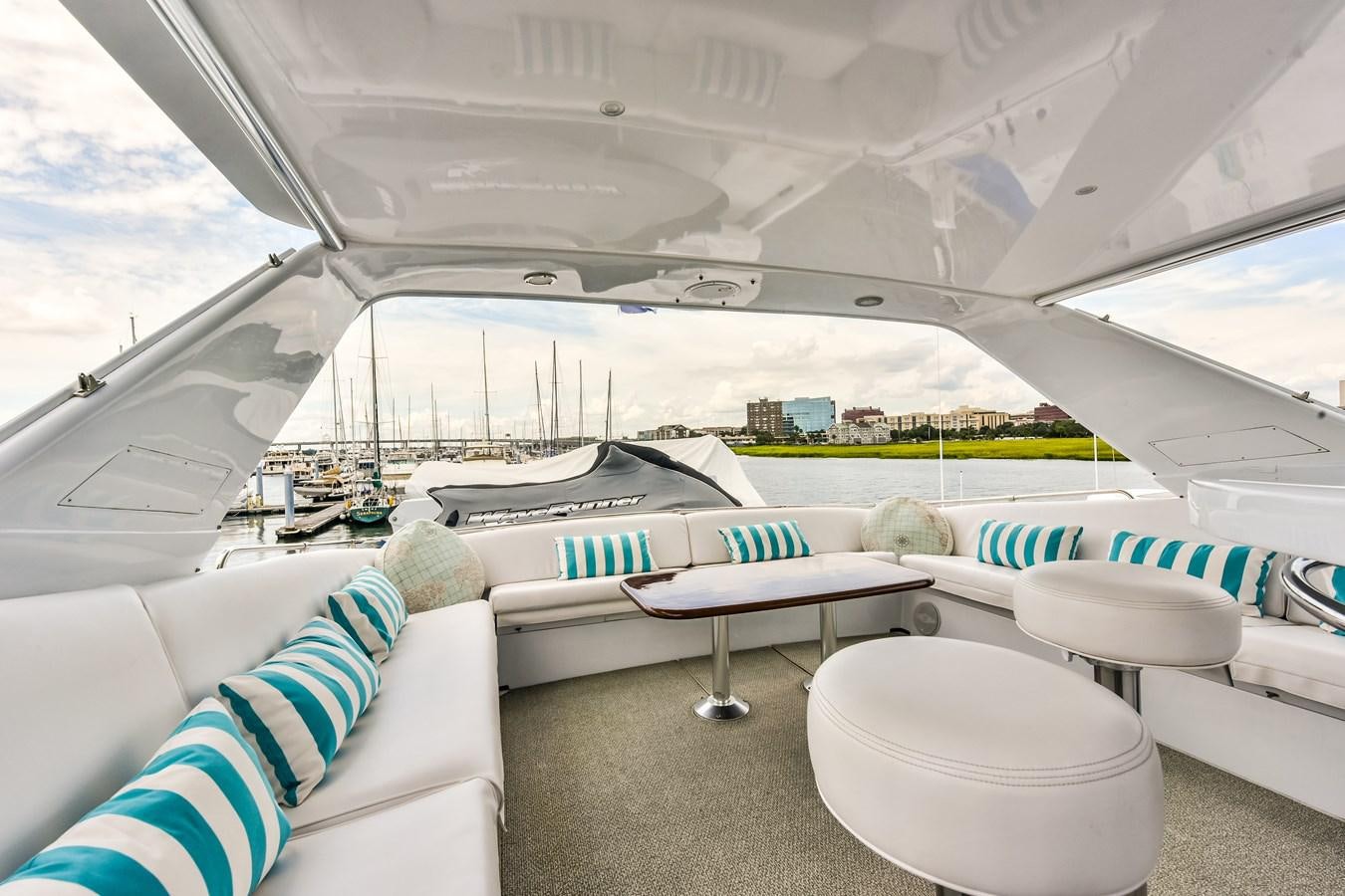 a room with a bed and a table aboard BOOGIE BABE III Yacht for Sale
