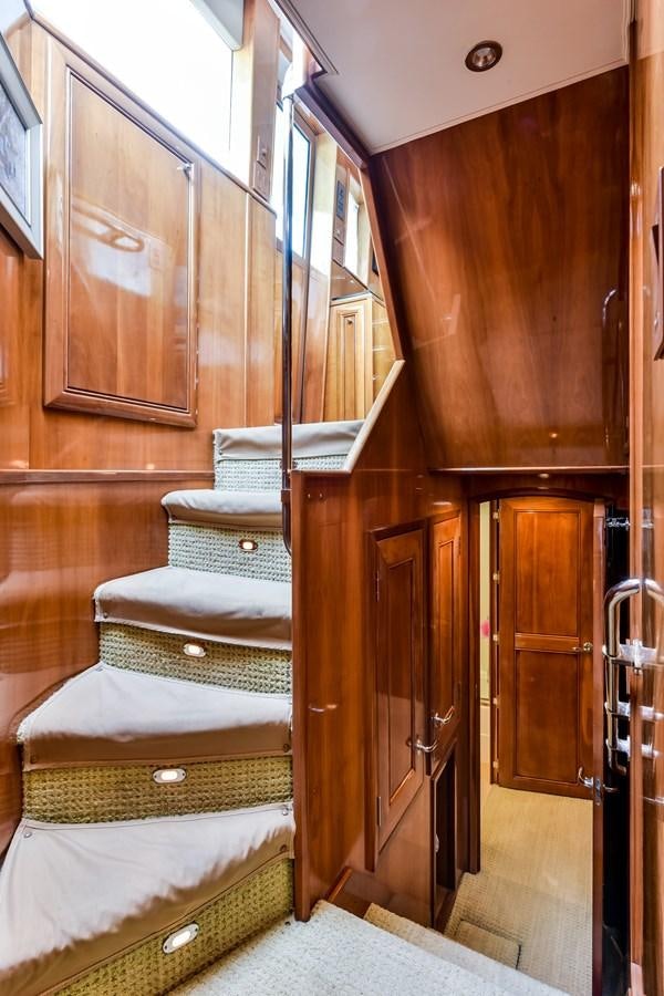 a wooden cabinet with drawers aboard BOOGIE BABE III Yacht for Sale
