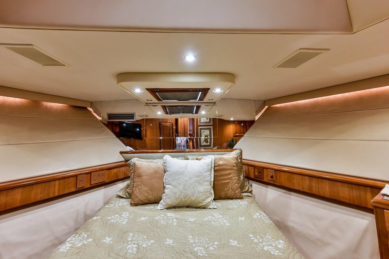 a bed with pillows aboard BOOGIE BABE III Yacht for Sale