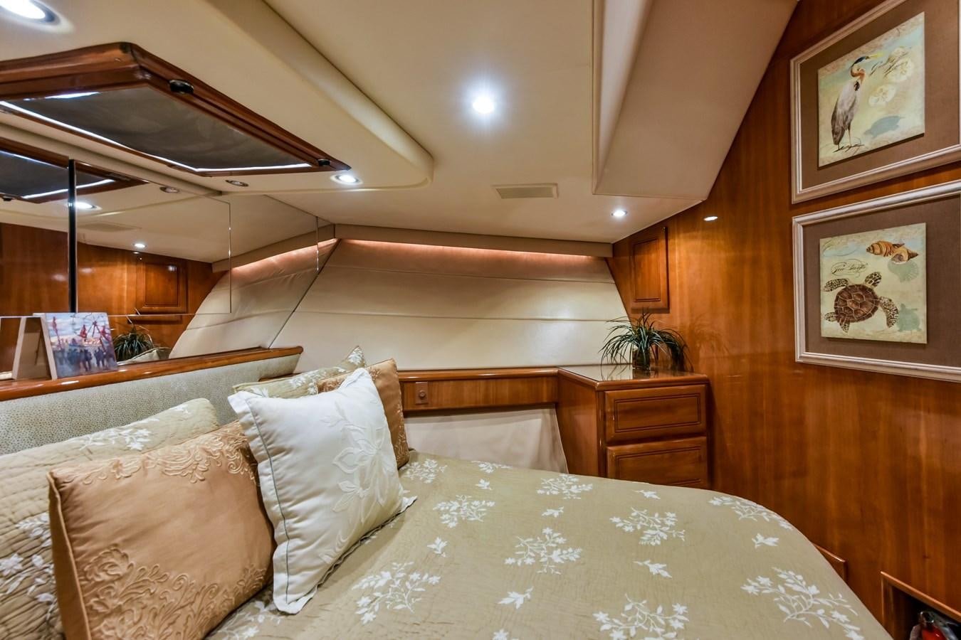 a bed with white sheets aboard BOOGIE BABE III Yacht for Sale