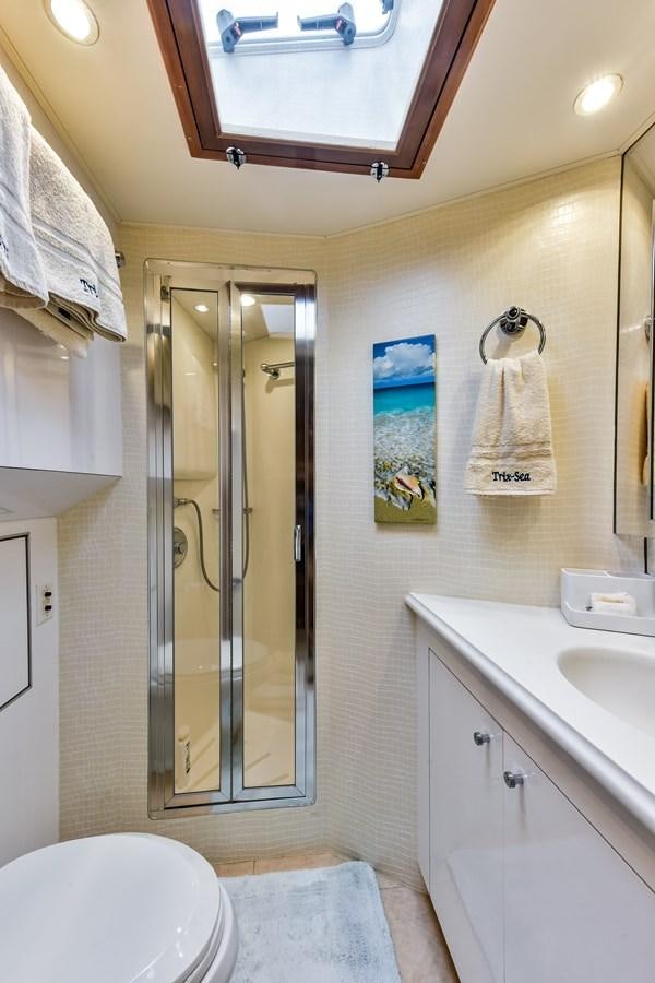 a bathroom with a glass shower aboard BOOGIE BABE III Yacht for Sale