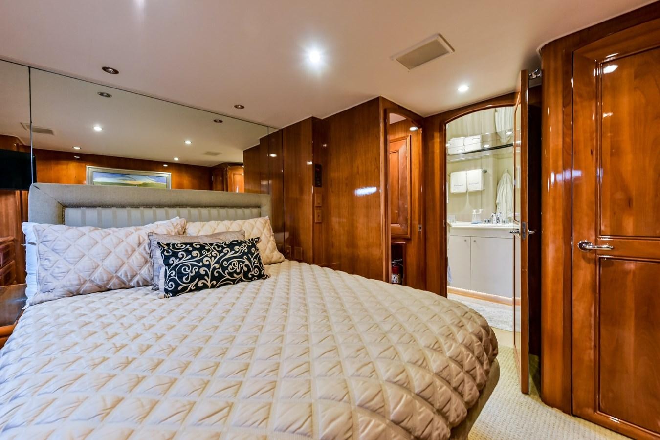 a bed in a room aboard BOOGIE BABE III Yacht for Sale