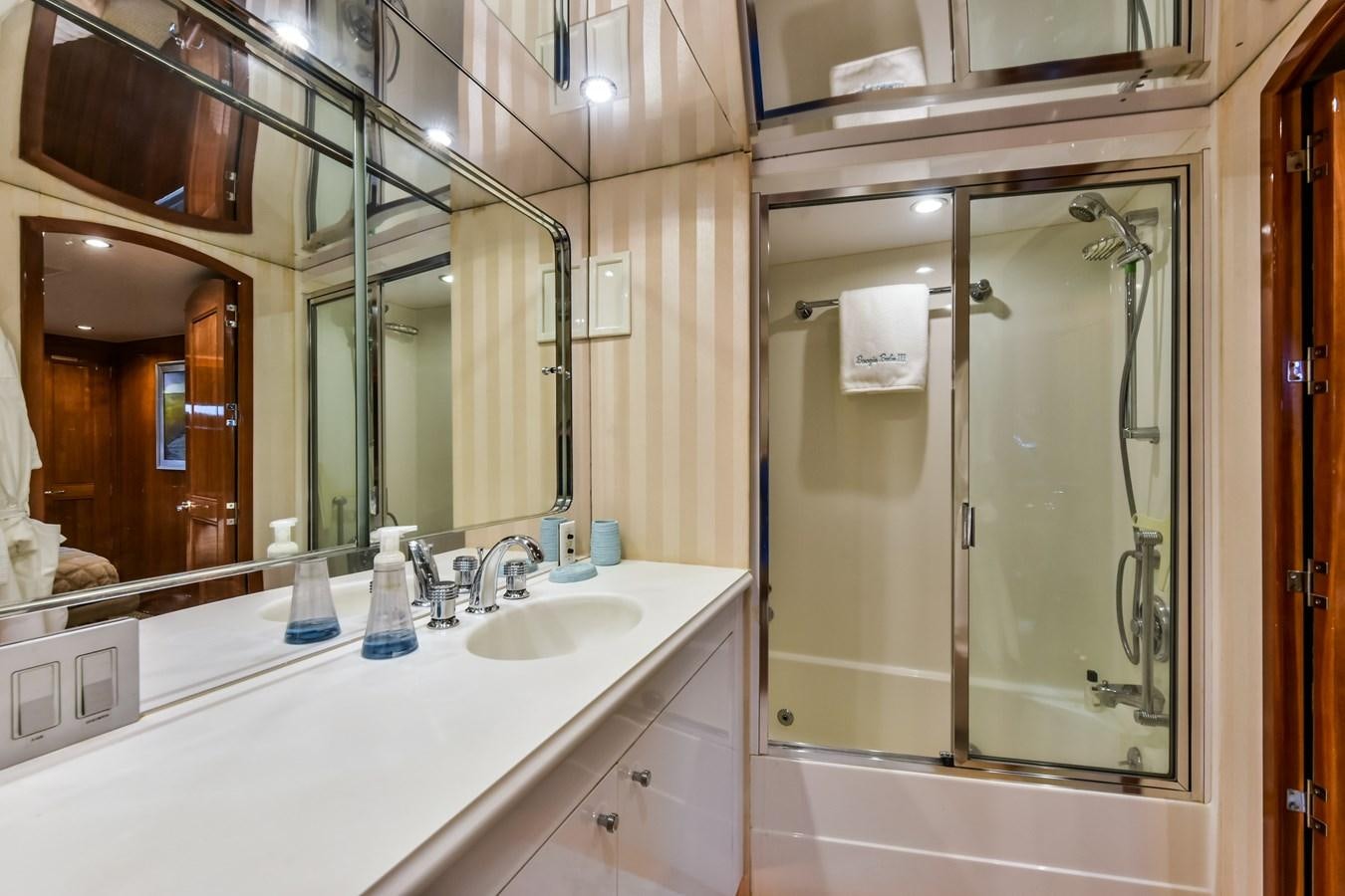a bathroom with a shower and sink aboard BOOGIE BABE III Yacht for Sale