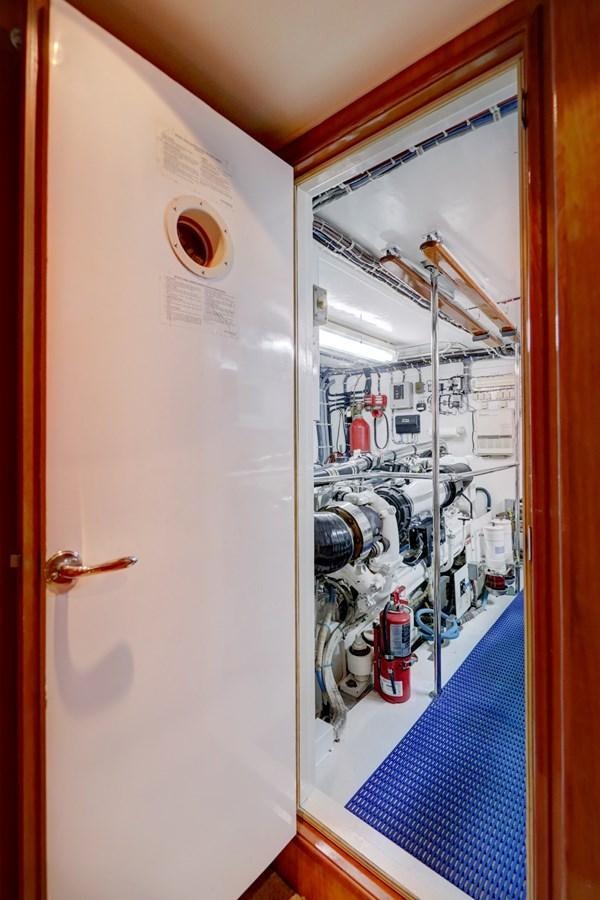 a white door with a blue mat aboard BOOGIE BABE III Yacht for Sale