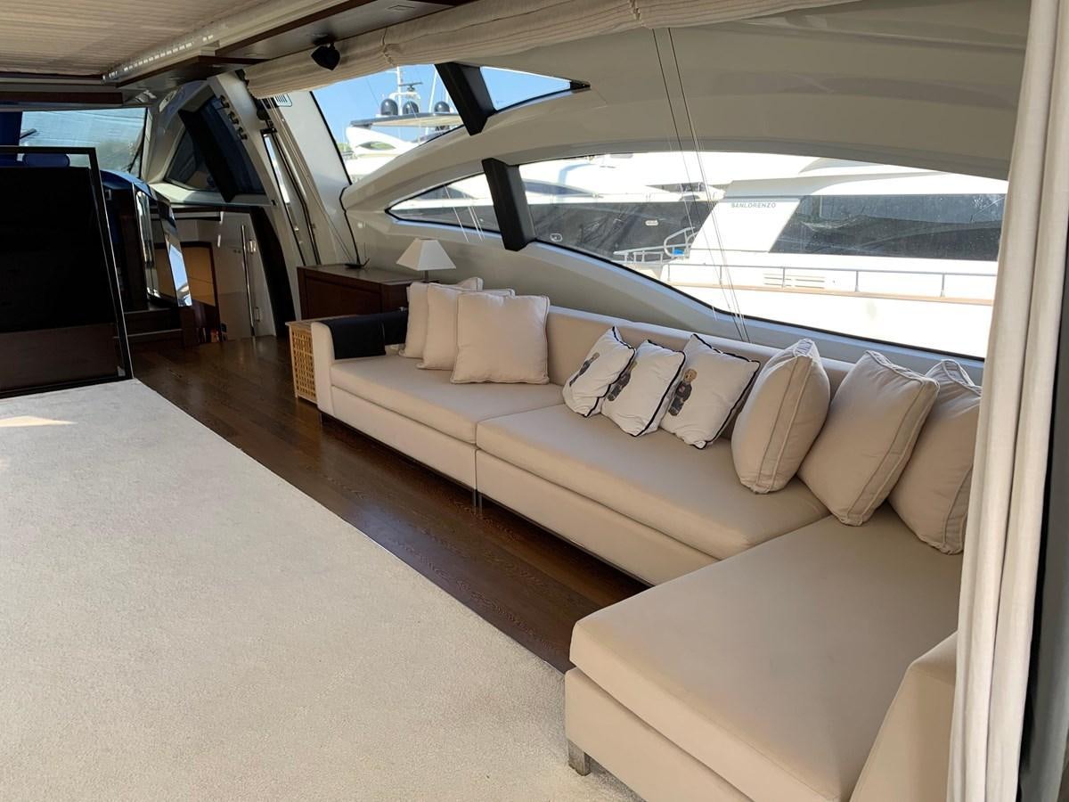 a room with a couch and a window aboard SURVIVOR Yacht for Sale
