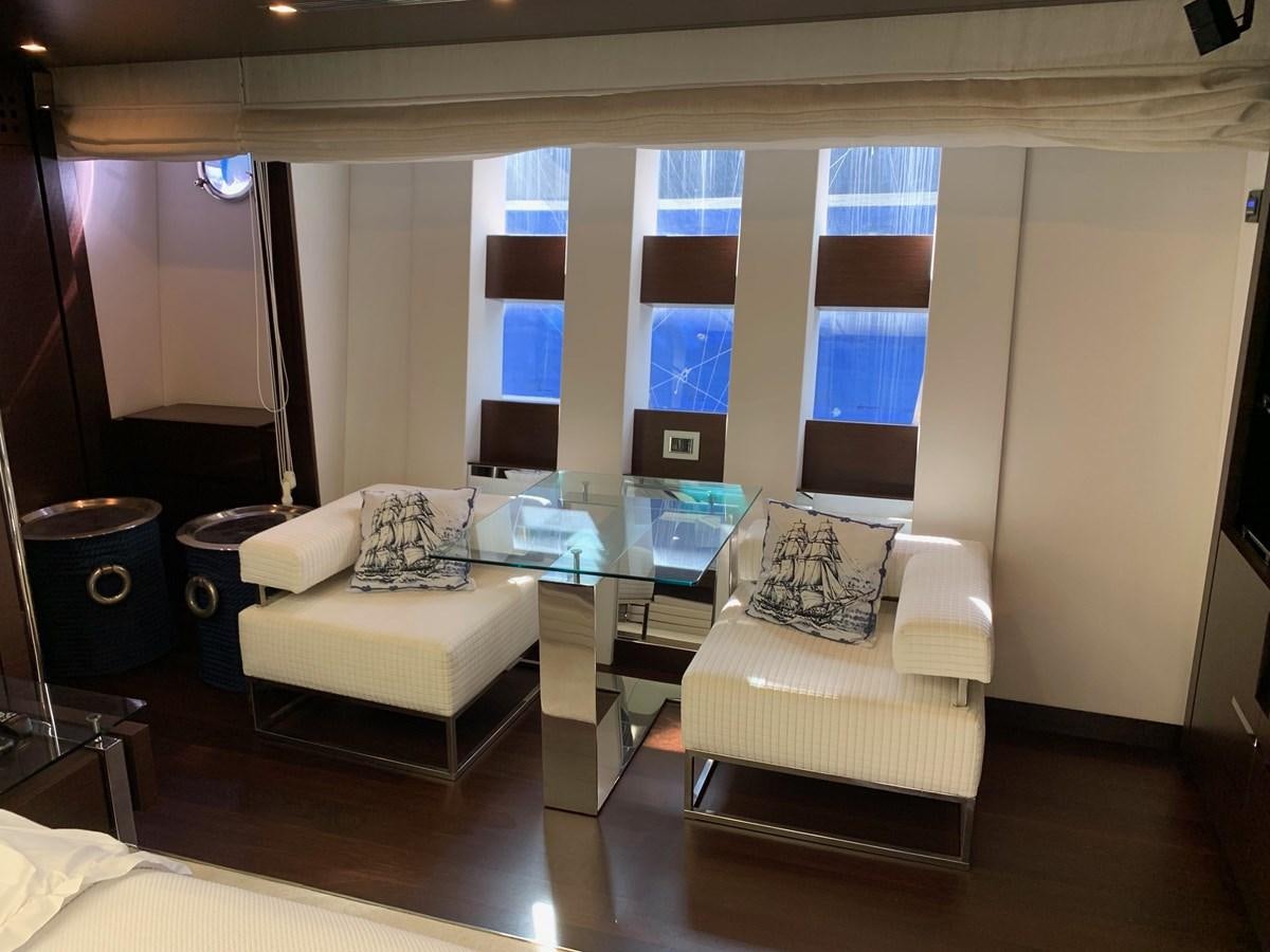 a room with a table and chairs aboard SURVIVOR Yacht for Sale
