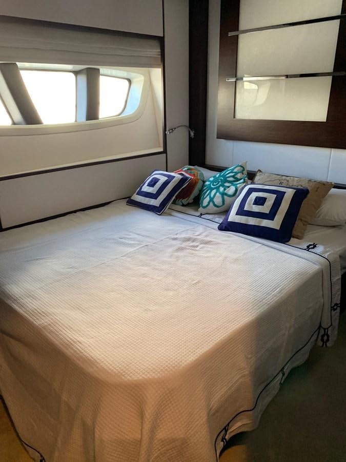 a bed with pillows aboard SURVIVOR Yacht for Sale
