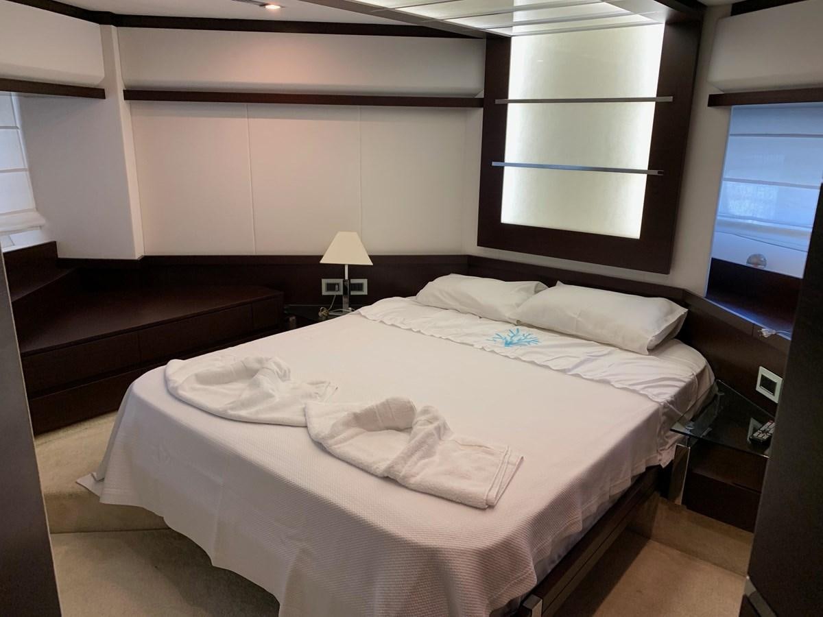 a room with a bed and a window aboard SURVIVOR Yacht for Sale