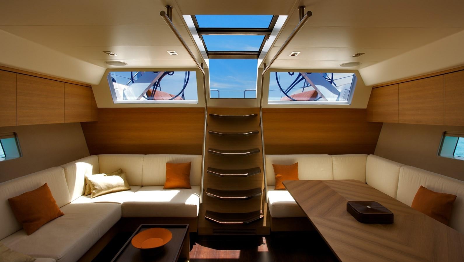 a room with a bunk bed and a table aboard INDIO Yacht for Sale