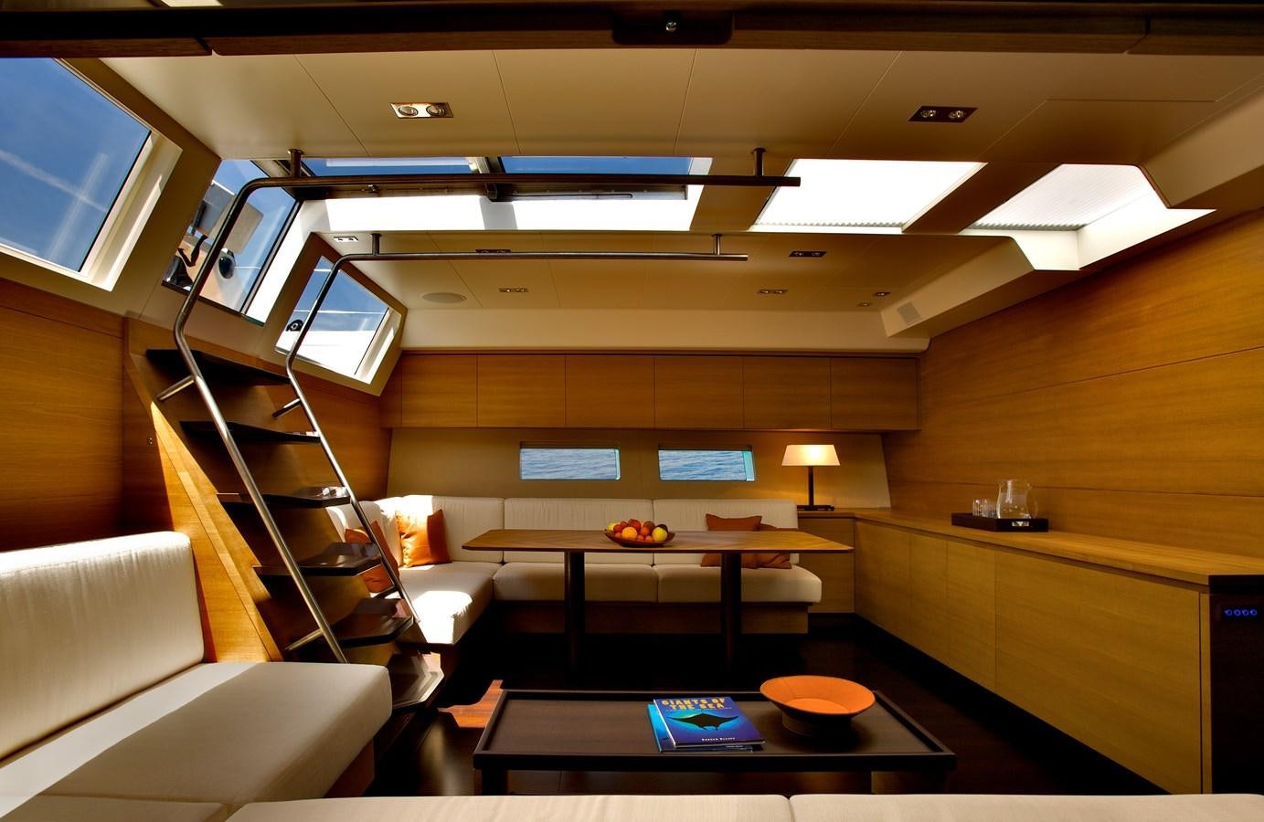 a room with a table and chairs aboard INDIO Yacht for Sale