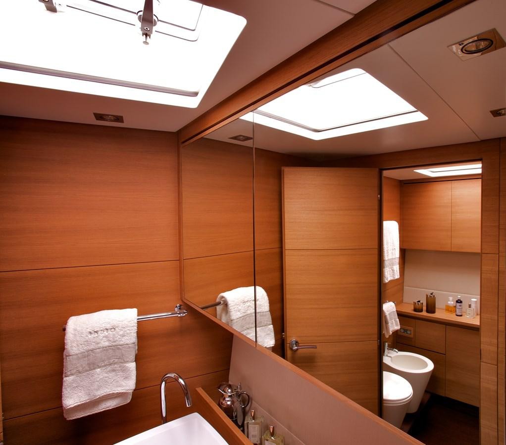 a bathroom with a shower and toilet aboard INDIO Yacht for Sale