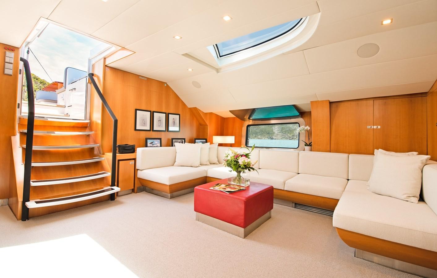 a living room with a staircase aboard SILVERTIP Yacht for Sale