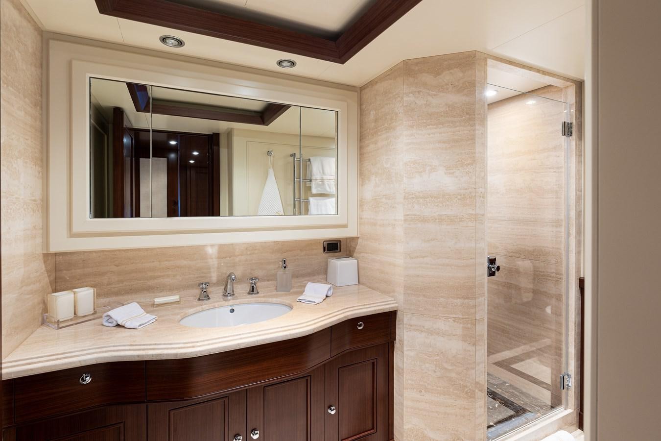 a bathroom with a glass shower aboard ONLY EIGHTY Yacht for Sale