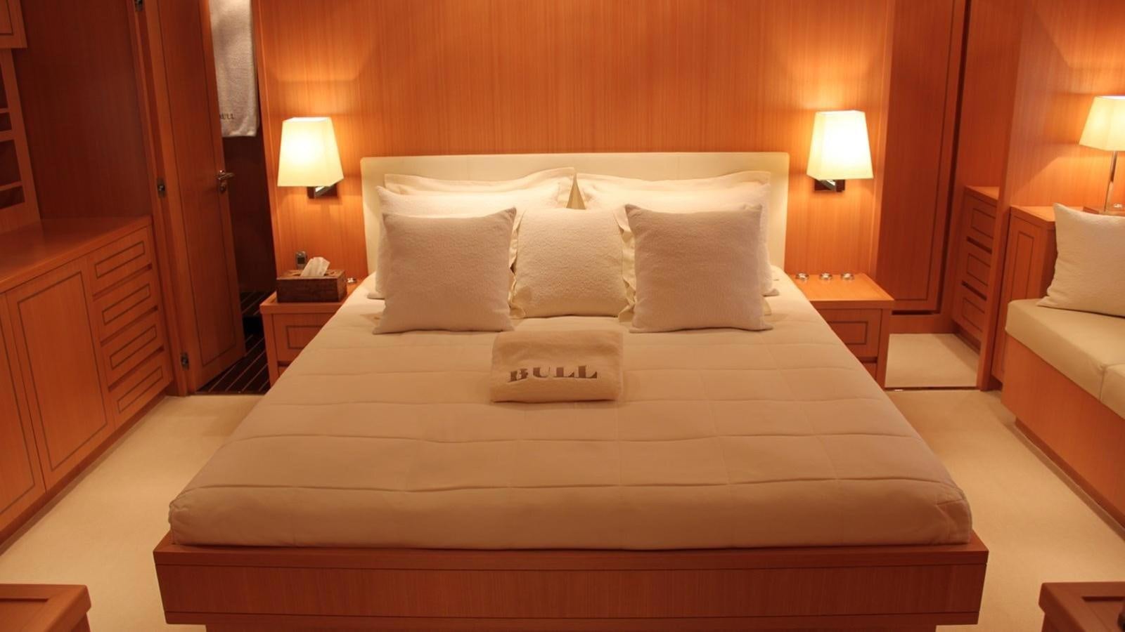 a bed with white sheets aboard MAZAG Yacht for Sale