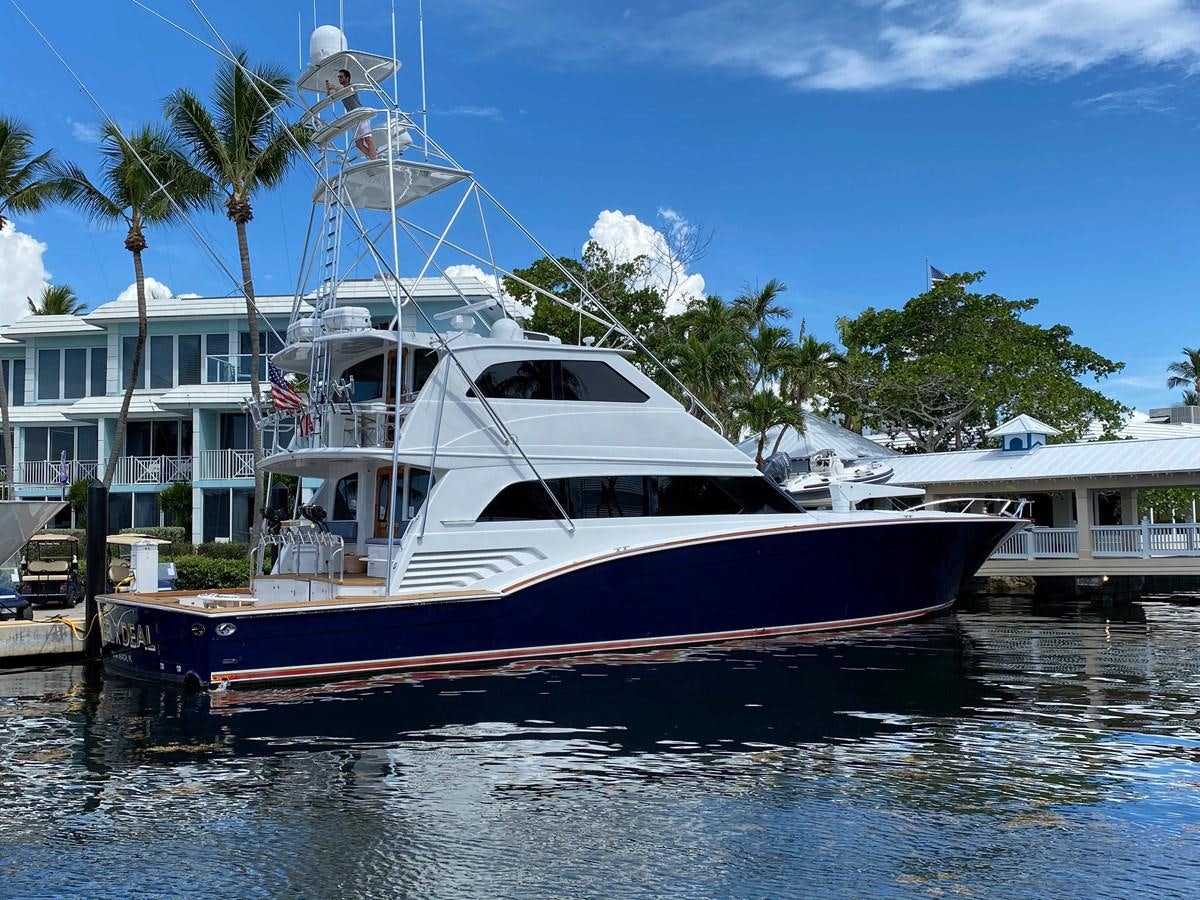 a boat docked at a pier aboard REEL DEAL Yacht for Sale