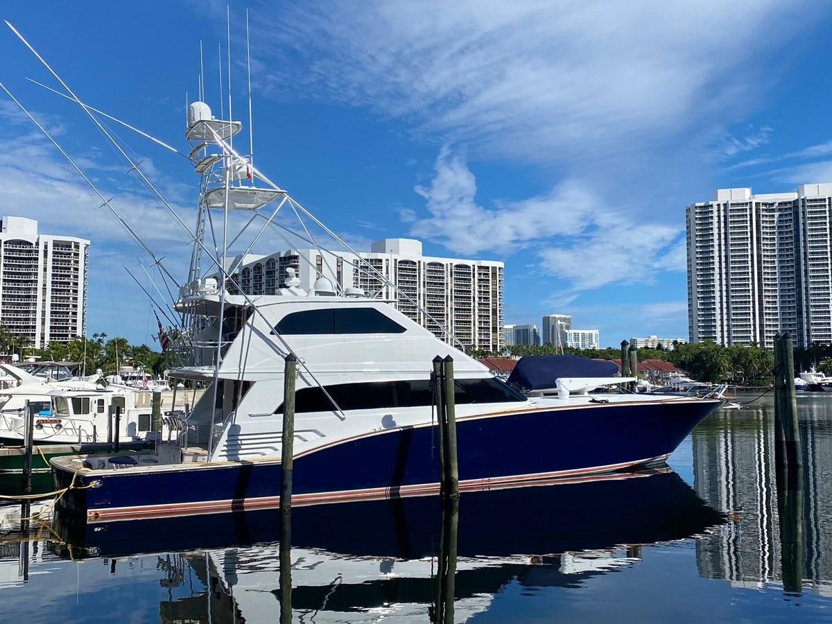 a boat docked at a pier aboard REEL DEAL Yacht for Sale
