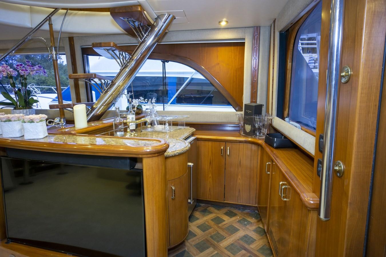a kitchen with a large glass window aboard REEL DEAL Yacht for Sale