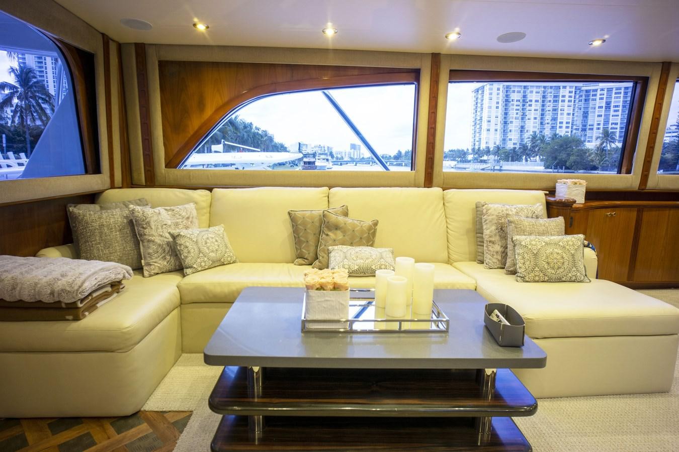 a living room with a large window aboard REEL DEAL Yacht for Sale