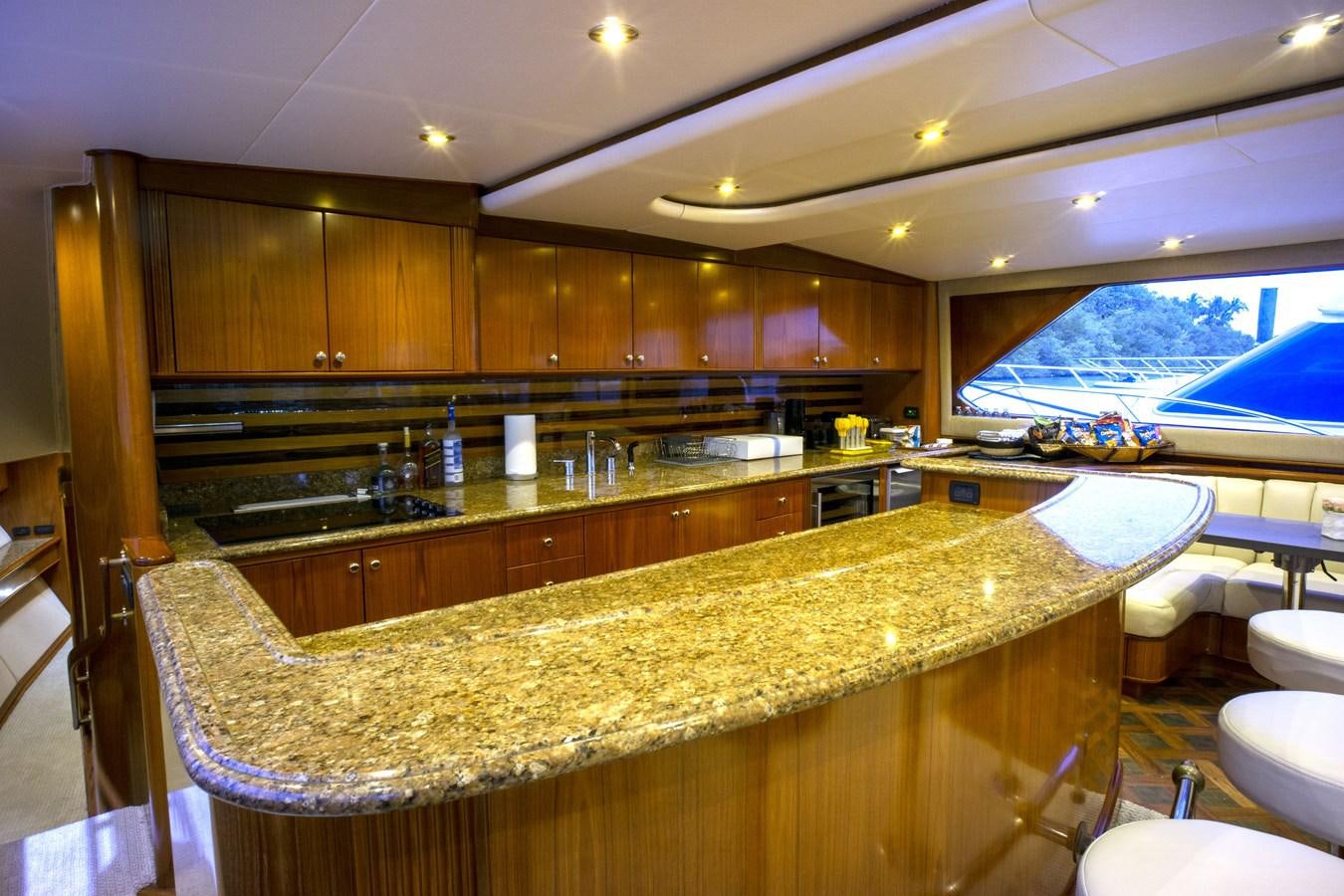 a kitchen with a large island aboard REEL DEAL Yacht for Sale