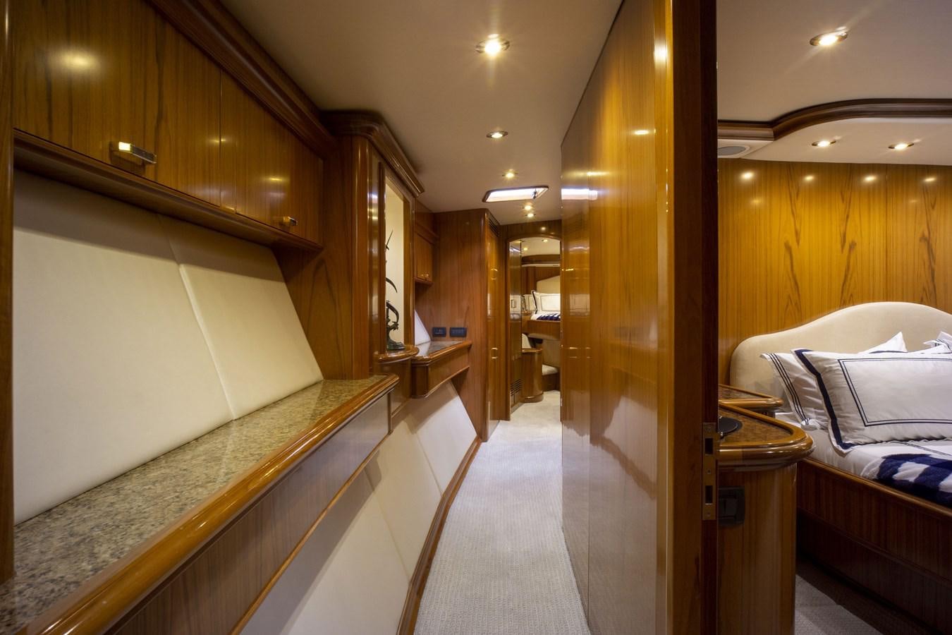 a room with a bed and a mirror aboard REEL DEAL Yacht for Sale