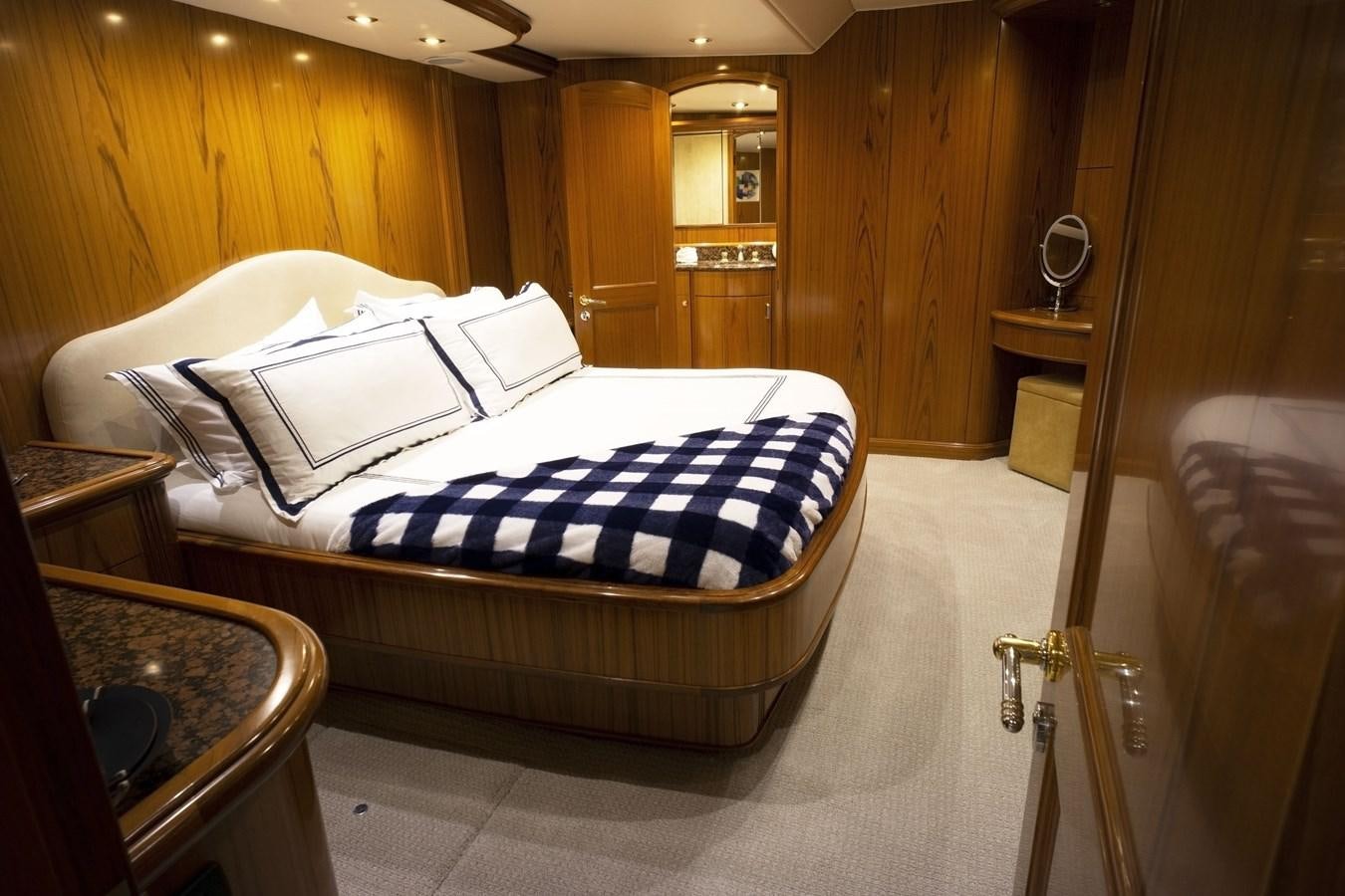a bed in a room aboard REEL DEAL Yacht for Sale