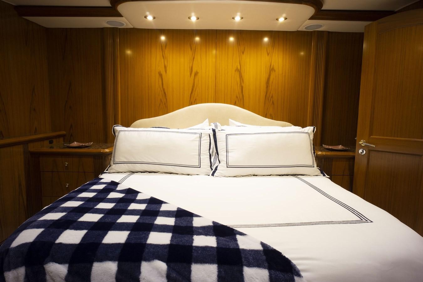 a couple of beds in a hotel room aboard REEL DEAL Yacht for Sale