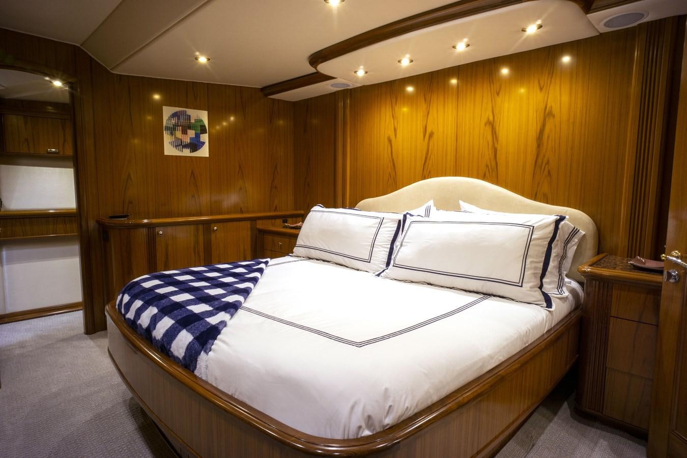 a bed with white sheets aboard REEL DEAL Yacht for Sale