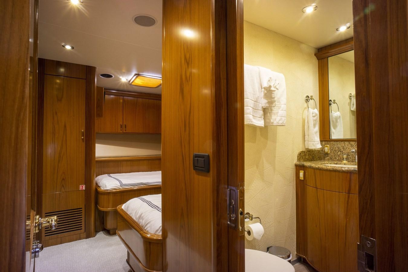 a bathroom with a large mirror aboard REEL DEAL Yacht for Sale