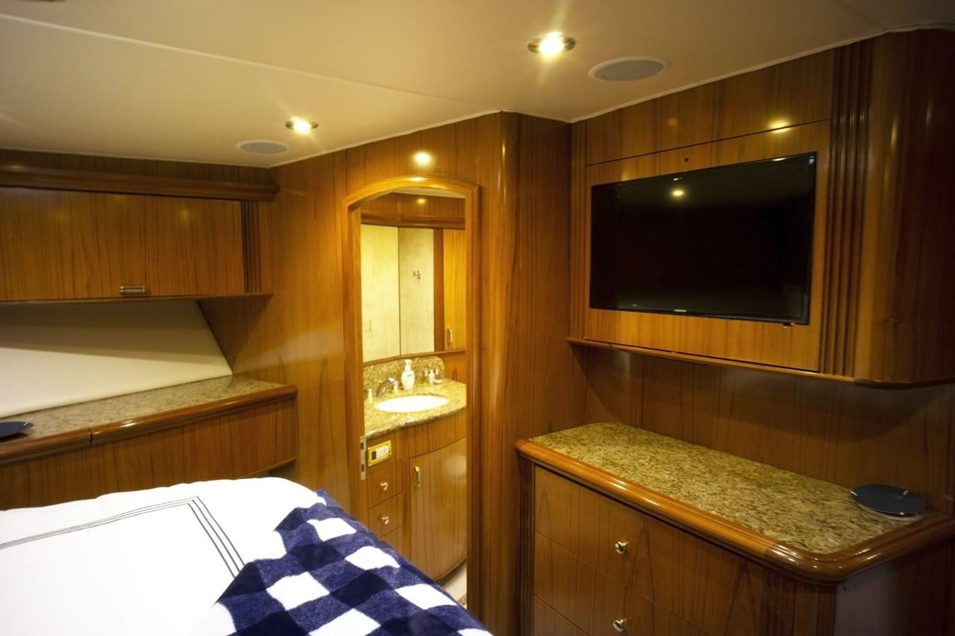 a bathroom with a large mirror aboard REEL DEAL Yacht for Sale