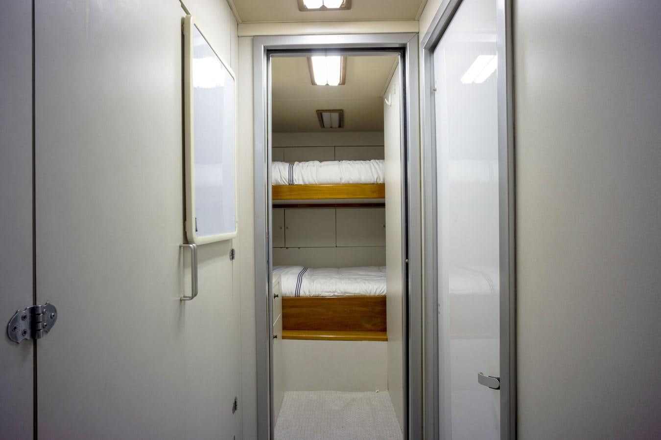 a closet with a bed aboard REEL DEAL Yacht for Sale
